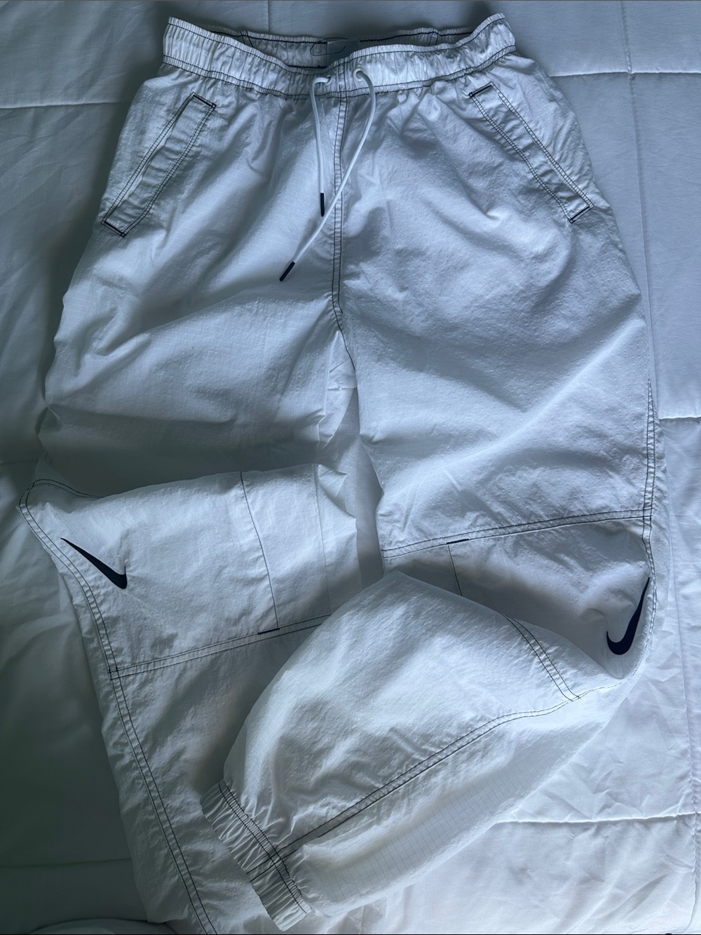 Nike White Drawstring Mesh-Lined Jogger Pants with Black Stitching